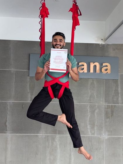 Another happy graduate from our aerial TTC, confidently holding his certificate while suspended in the hammock. We love seeing our students embrace this new skill with such enthusiasm.