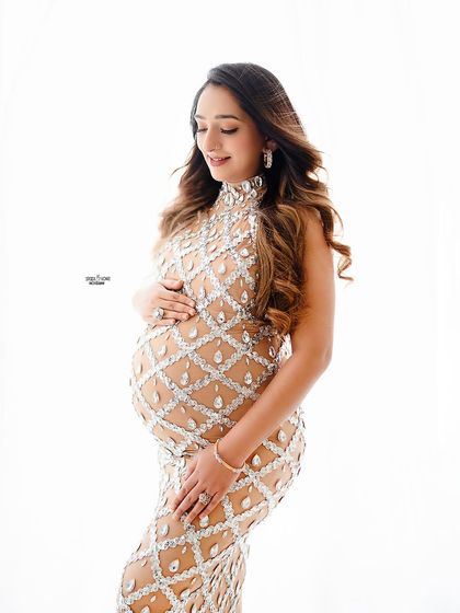 This high-key portrait in a sparkling gown is all about capturing pure joy. We'll cover lighting and posing that makes your clients glow.