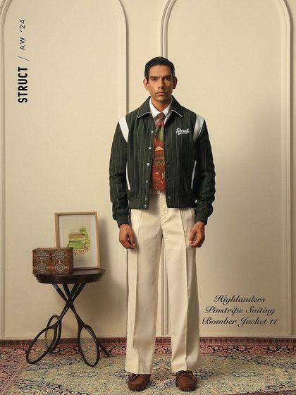 A styled shot of the Highlanders Bomber Jacket from Struct, blending classic and street-style elements.