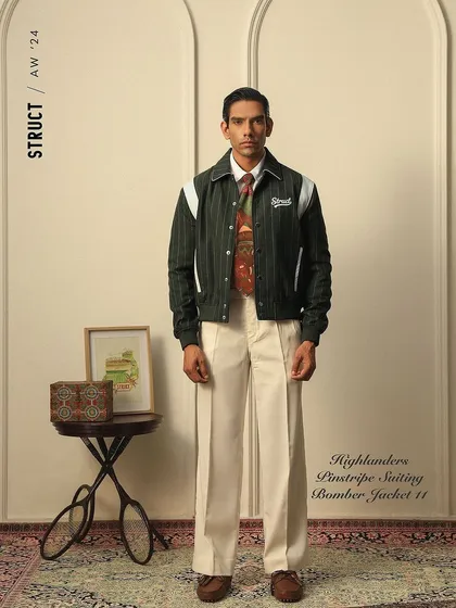 A styled shot of the Highlanders Bomber Jacket from Struct, blending classic and street-style elements.