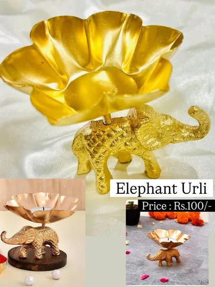 This elegant elephant urli is a unique and decorative piece for holding a candle or floating flowers. It adds a touch of traditional Indian artistry to any decor.