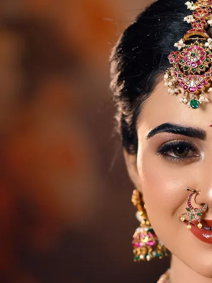 Photography for me is about finding a unique perspective. This artistic close-up focuses on the expressive power of the eyes, the intricate maang tikka, and the delicate nose ring, telling a story in just half a frame.