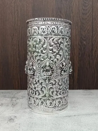 A duplicate image of the tall antique Lakshmi container, a premium item for special rituals.