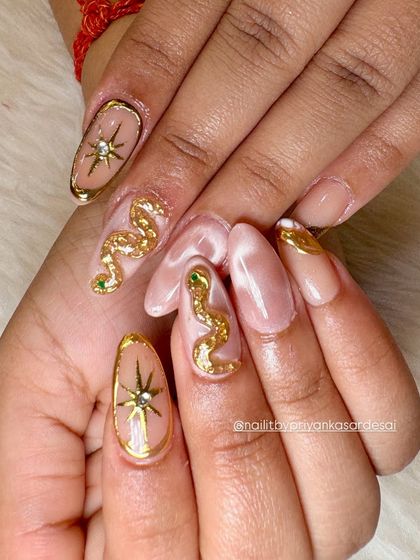 A close-up shot that highlights the texture and detail of the sculpted golden snake. You can even see the tiny green crystal I used for the eye.