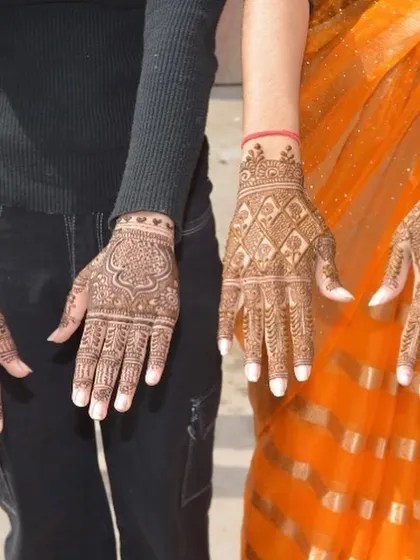Two clients showing their complementary traditional designs. This is a great example of how I can create coordinated looks for bridesmaids or family members.