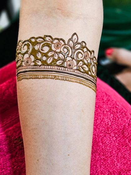 A close-up of a beautiful floral armband, showcasing the delicate shading.