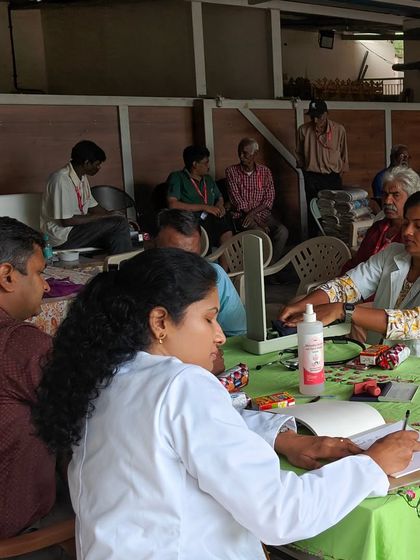My team and I taking notes and examining patients at the free camp. Every person deserves access to proper skin health diagnosis and treatment.