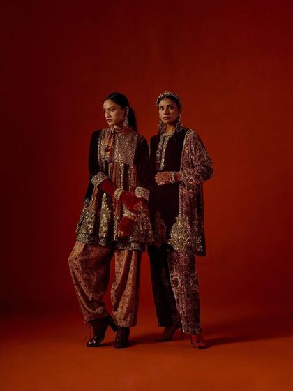 A full-length shot of two models in complementary Debyani & Co outfits, demonstrating the collection's cohesive aesthetic.