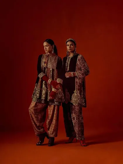 A full-length shot of two models in complementary Debyani & Co outfits, demonstrating the collection's cohesive aesthetic.