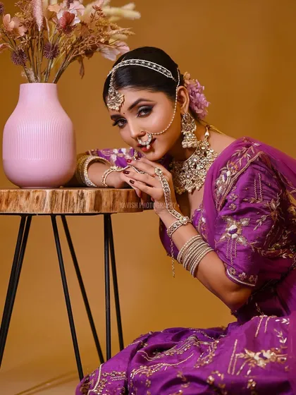 A striking pose from the same session, looking directly at the camera.