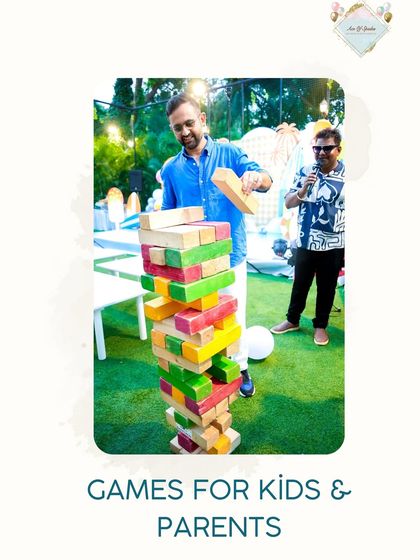 I always make sure there's fun for everyone, including the parents. Here, you can see adults enjoying a giant Jenga game on the lawn, making it a true family event.