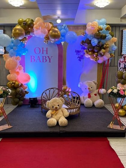 The complete 'Oh Baby' stage setup with balloon pillars, backdrops, and props, ready for the celebration.