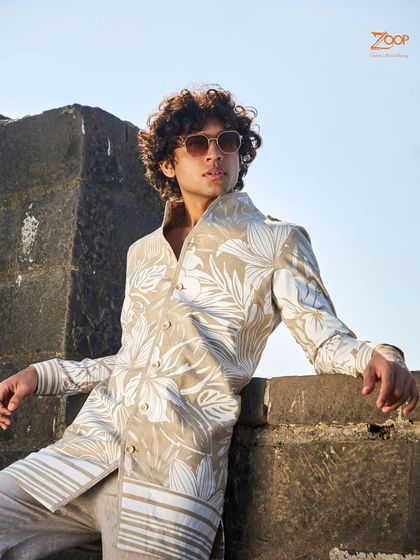 I love to reimagine the power of neutrals. This beige shirt features a serene white floral print, meticulously crafted into the fabric for a touch of calm sophistication.