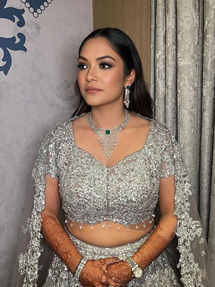 The complete look, showing how sleek, straight hair can be just as impactful for a cocktail event.