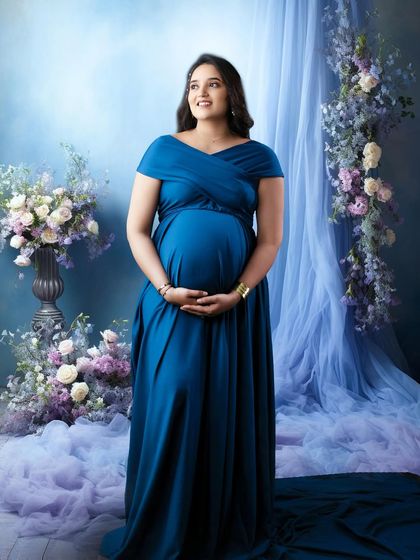 A full portrait in the blue gown, set against a dreamy backdrop of floral arrangements and soft blue curtains. The overall effect is romantic and ethereal.