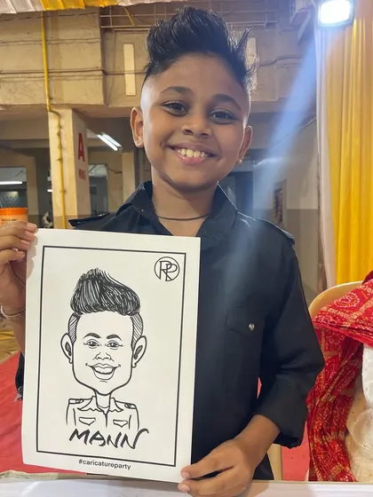 It's always a blast drawing for kids. I loved capturing this young man's cool style at a Haldi event in Panvel. Caricatures are a fantastic and fun activity for children's parties.