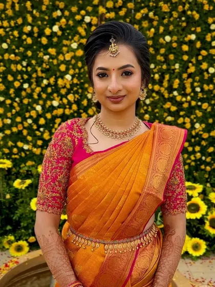 A vision of pure elegance against a backdrop of sunshine yellow. I designed this South Indian bridal makeup to be fresh and radiant, with a focus on flawless skin and eyes that sparkle, perfectly complementing her bright and beautiful saree.