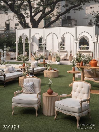 Perfectly uniform and effortlessly elegant, the seating arrangement is a flawless fit for this ivory-themed wedding. I combined classic armchairs with traditional Indian daybeds to create varied and comfortable lounging spaces.
