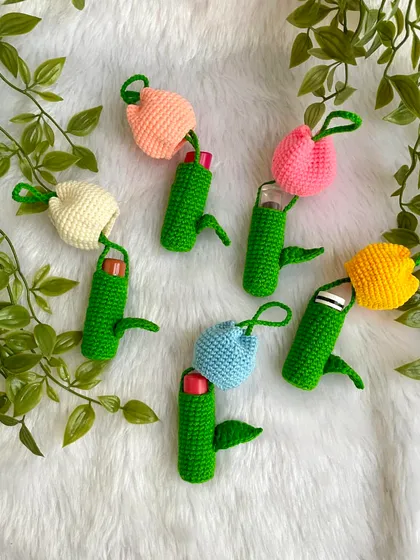 My tulip lipstick holders in action. They are designed to hold a standard lipstick or lip balm, keeping it safe and easy to find in your bag.