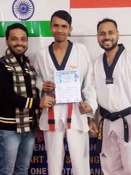 A senior student receives his certificate. We celebrate the journey of each member of our Taekwondo family.