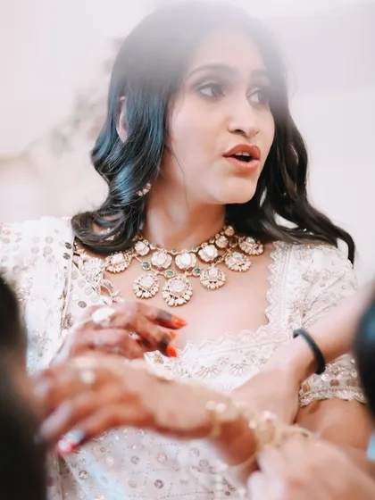 A candid moment captured during my baby shower. Even in motion, the custom hand harness adds a touch of grace and elegance to the overall look.