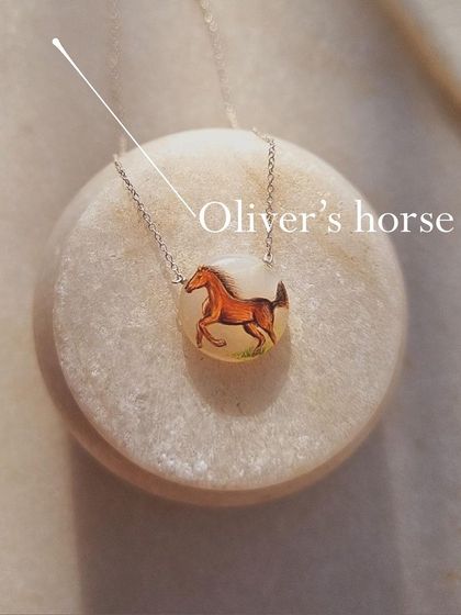 Another view of my 'Oliver's horse' pendant. Each one is painted by hand, making it a unique piece of art.