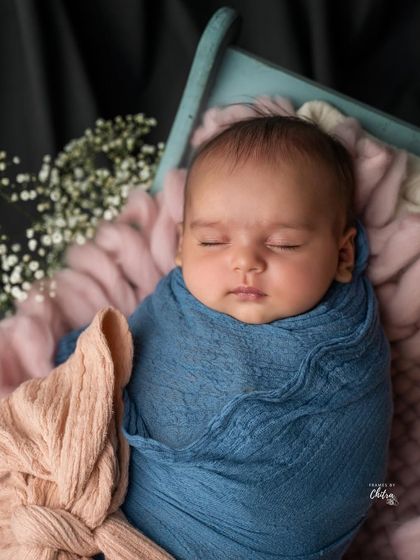 A version of the portrait without the headband, for a more simple and classic look, focusing just on the baby's peaceful face.