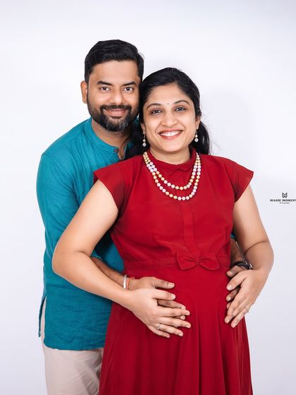 A slight variation in outfit, a world of love. This studio portrait shows the couple in a mix of traditional and modern attire, celebrating their journey together.