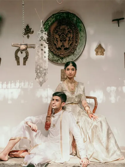 Elegance in simplicity. For this daytime wedding, we worked with the couple to create a timeless look, pairing their classic ivory outfits with the venue's natural heritage charm. This is how we turn moments into classic portraits.
