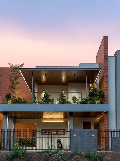 This is the Madani Residence at dusk, a project where we blended modern architectural lines with warm, inviting light. We believe a home's exterior should be a promise of the peace and beauty that lies within, using elements like cantilevered roofs and integrated planters to connect the structure with nature.
