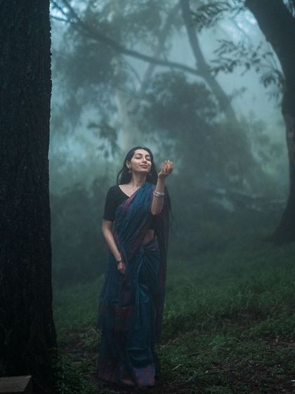 Enjoying the rain in the foggy forest, a shot filled with pure joy.