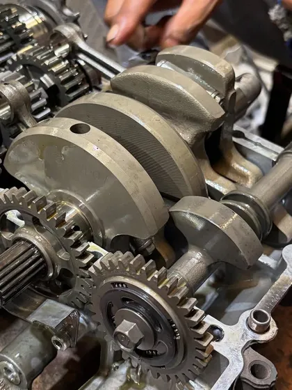 Can you guess the engine? This is a close-up of a 180-degree crank twin, showing the intricate gearing and crankshaft assembly we work on.