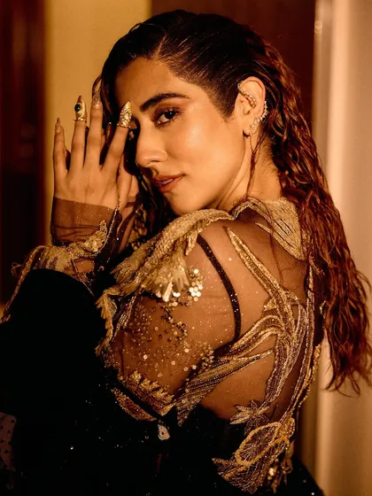 A series of images capturing the stunning Rahul Mishra Couture outfit I styled for Jonita Gandhi's performance. The detailed embroidery, flowing silhouette, and pairing with thigh-high Louboutin boots created a look that was both ethereal and powerful.