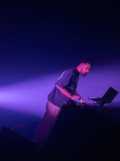 A wide shot of me on stage, bathed in purple light. The sense of space and atmosphere is key to a great club night.