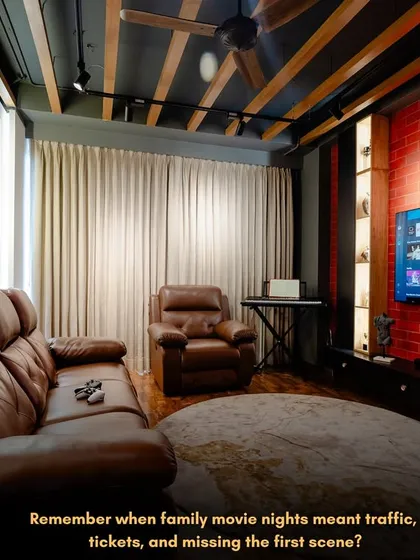 Forget traffic and tickets. I can bring the blockbuster experience right into your home. This is a custom home theatre I designed, complete with plush leather recliners, ambient track lighting, and an exposed brick wall for that rustic, industrial vibe.