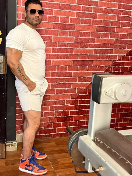 A quick pose in the gym. The "Warrior" tattoo on my arm is a reminder of the mindset needed to succeed.