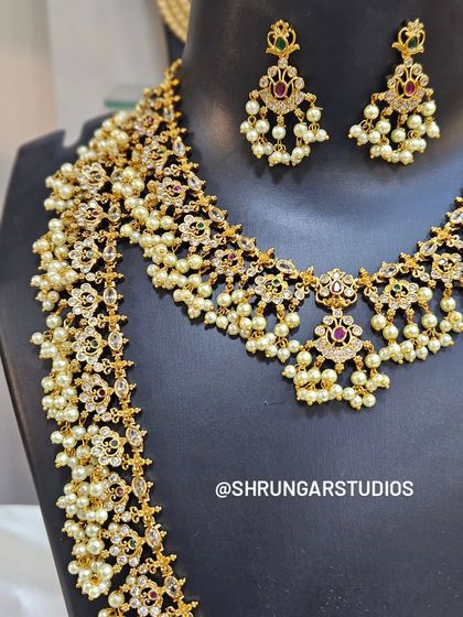 This side view shows the beautiful cascade of pearls and the craftsmanship of the long haar.