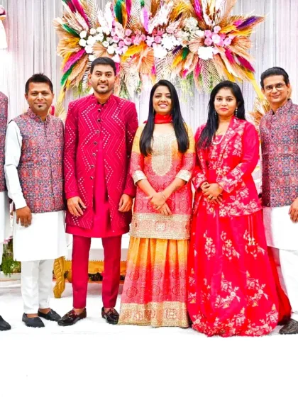 Posing with the talented musicians and the groom's side. We often coordinate our outfits to be a part of the wedding's theme.