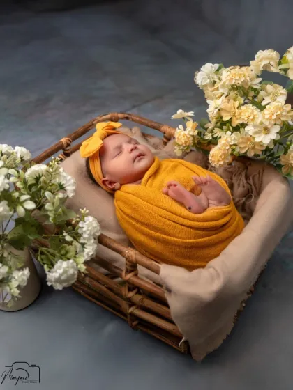 Another beautiful angle of the newborn in the basket setup, sleeping soundly.