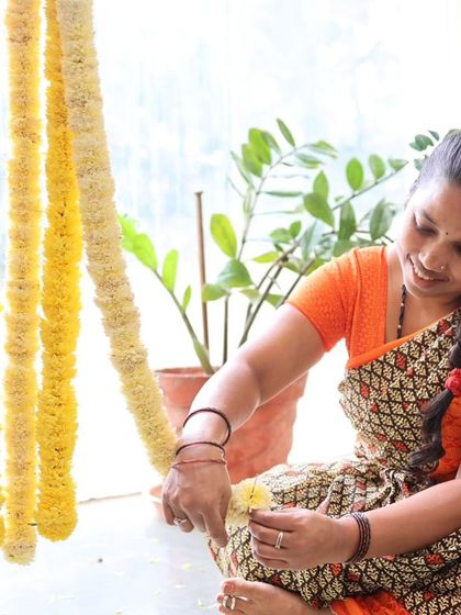 A team member carefully arranging flower petals.