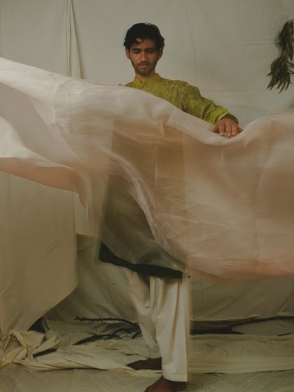 This shot uses a sheer piece of fabric to create a sense of mystery and texture. It’s an experimental approach that results in a unique and memorable image for an artistic portfolio.