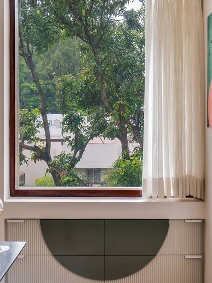 Another view of the unique sideboard in the dining area, showcasing its fluted texture and geometric design.