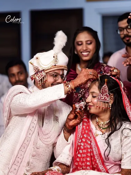 A beautiful moment during the wedding ceremony where a family member blesses the bride.