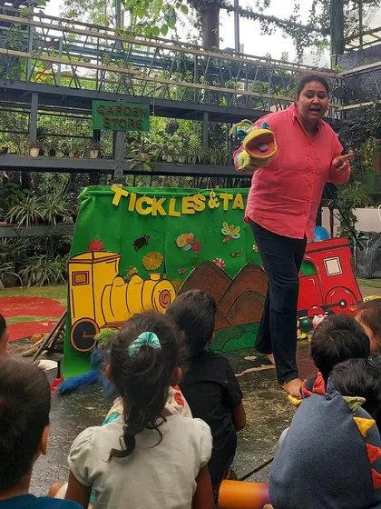 Performing "The Little Blue Engine" for a large group of families at a school celebration. It was amazing to see so many people cheering and enjoying the story.