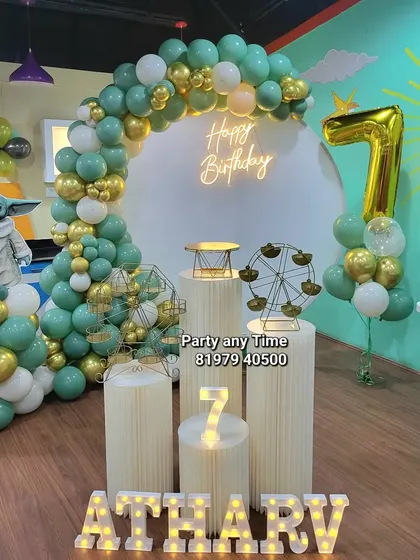 I can bring any theme to life, like this fun Star Wars Yoda setup for a 7th birthday. It includes a custom character cutout, a green, white, and gold balloon arch, and a large number 7 foil balloon.