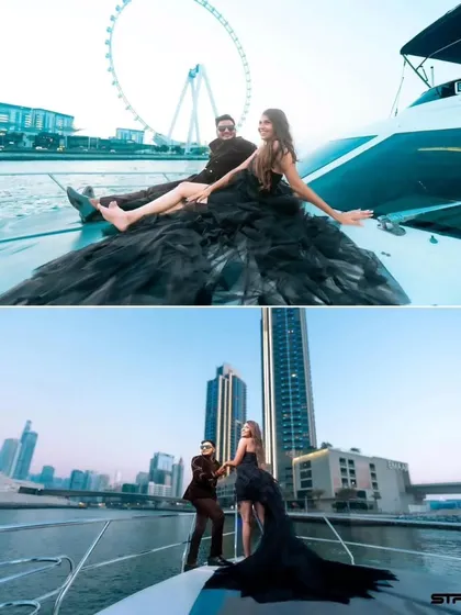 A glamorous pre-wedding shoot on a yacht in Dubai. This black high-low gown with a dramatic ruffled train is perfect for a chic and modern couple.