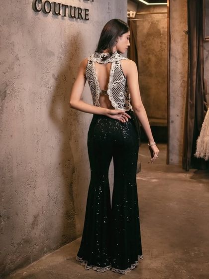 Embrace the festive season with this chic ensemble featuring a waistcoat adorned with delicate pearl embroidery, complemented by fully sequin-embellished pants.