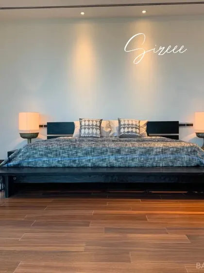 The same bedroom view, this time with a focus on the minimalist wall and spotlighting that keeps the attention on the view and the room's spaciousness.