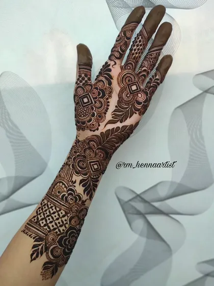 I'm so happy with how this full-arm mehendi turned out. It's a beautiful mix of different patterns that come together to create a stunning bridal look.