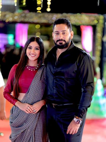 A great shot of celebrity couple Prajwal Devaraj and Ragini Prajwal posing together on the red carpet.